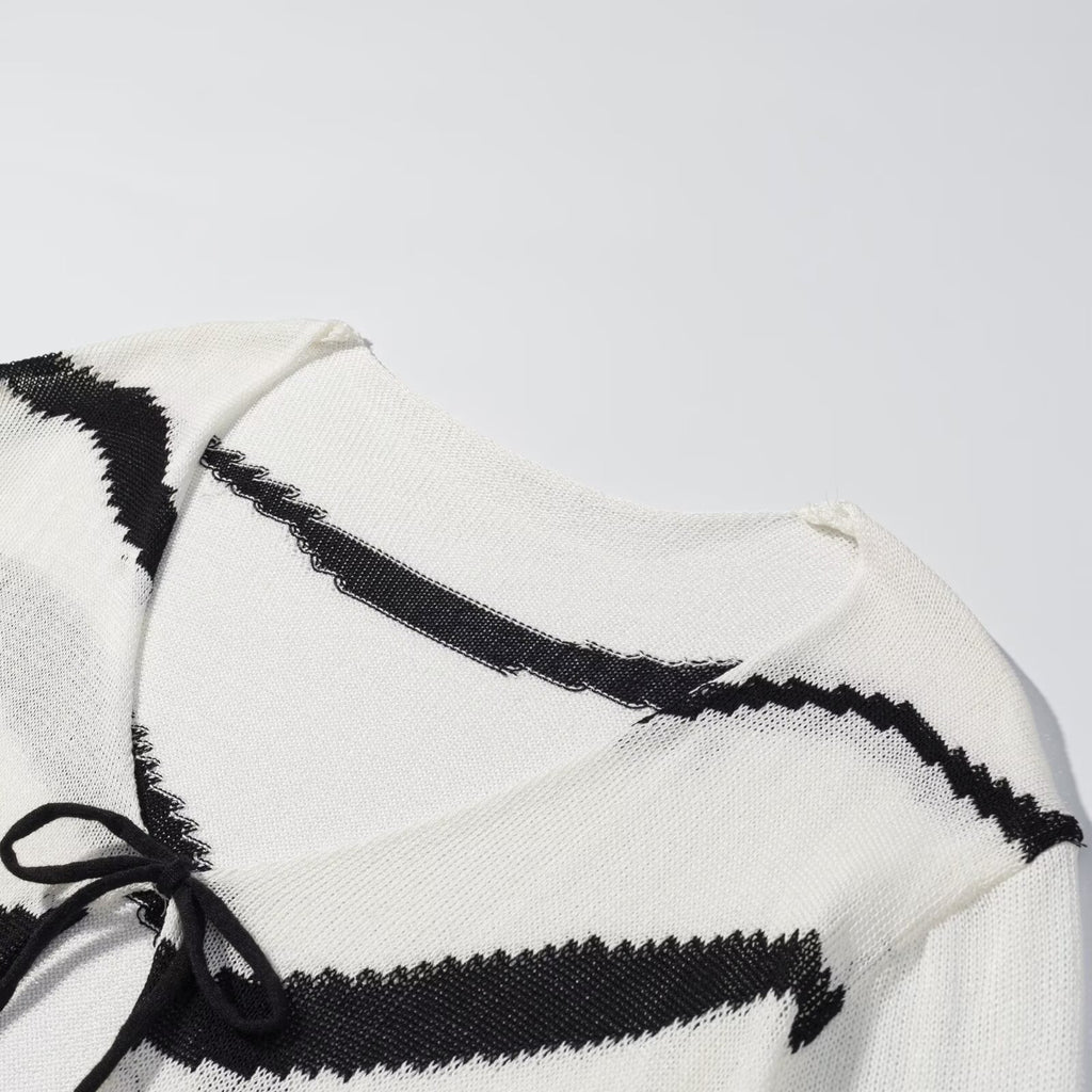 Thin knit cardigan with diagonal straps