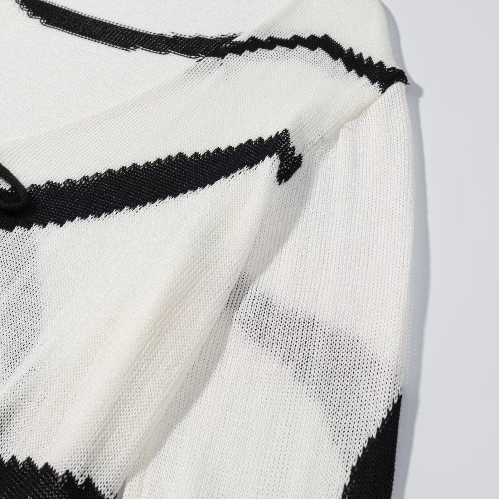 Thin knit cardigan with diagonal straps
